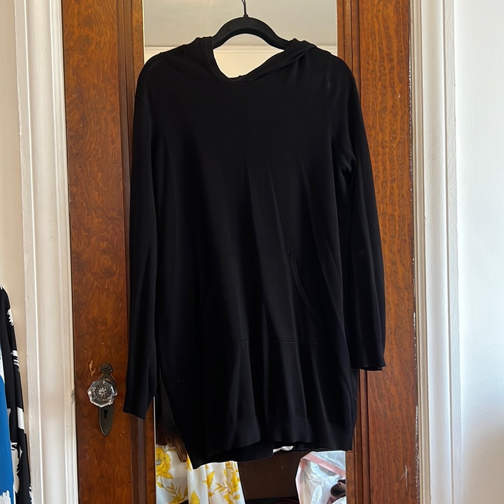 This is a plain black hoodie that is thin and perfect for styling!